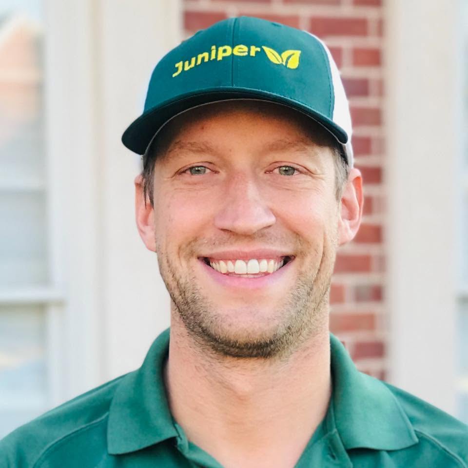 Mike Hannan, owner of Juniper Pinestraw, wearing a Juniper cap